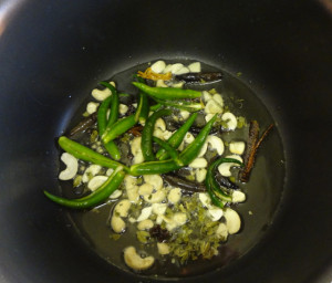 Adding green chillies into the pan